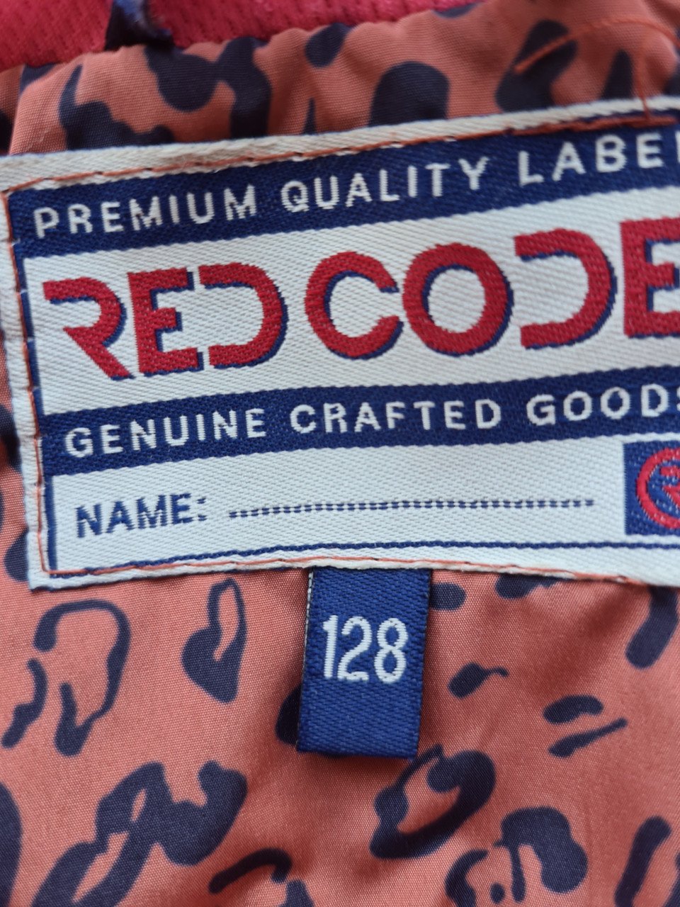 Roest bruin -zwart regenjack met capuchon van Red Code  Maat 128