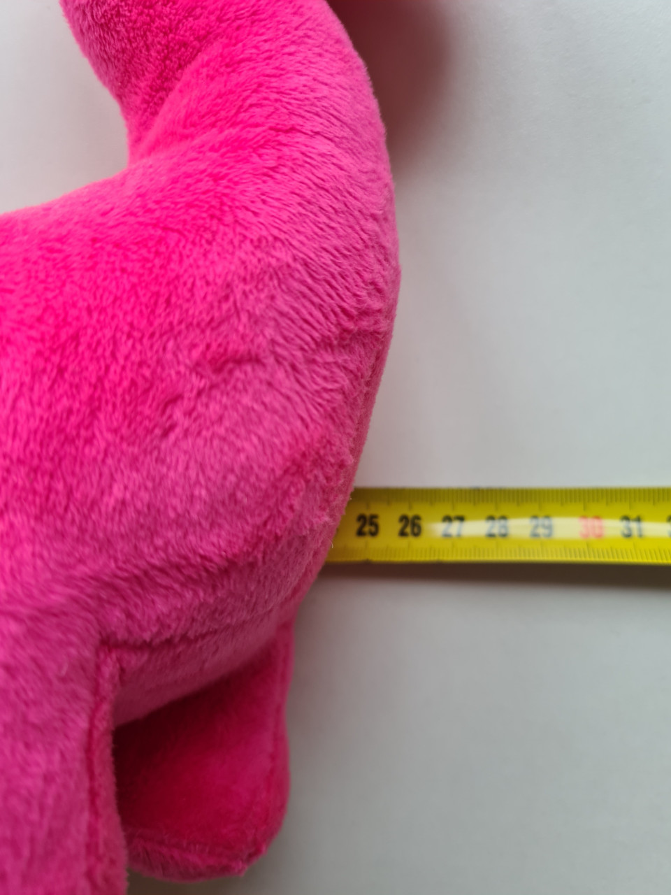 Schattige roze dinosaurus knuffel
