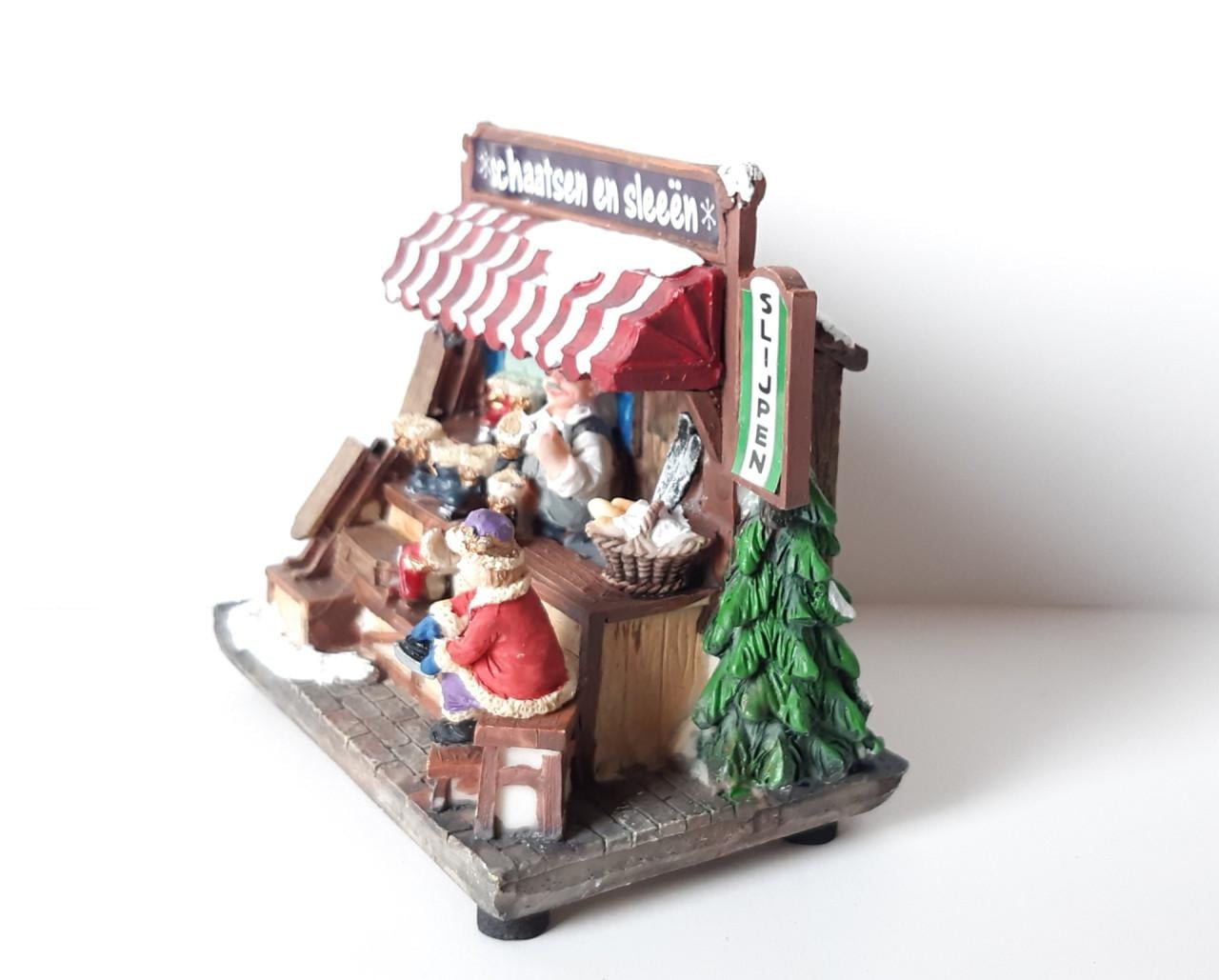 Hollands kraam: schaatsen en sleeën, kerstdecoratie met verlichting