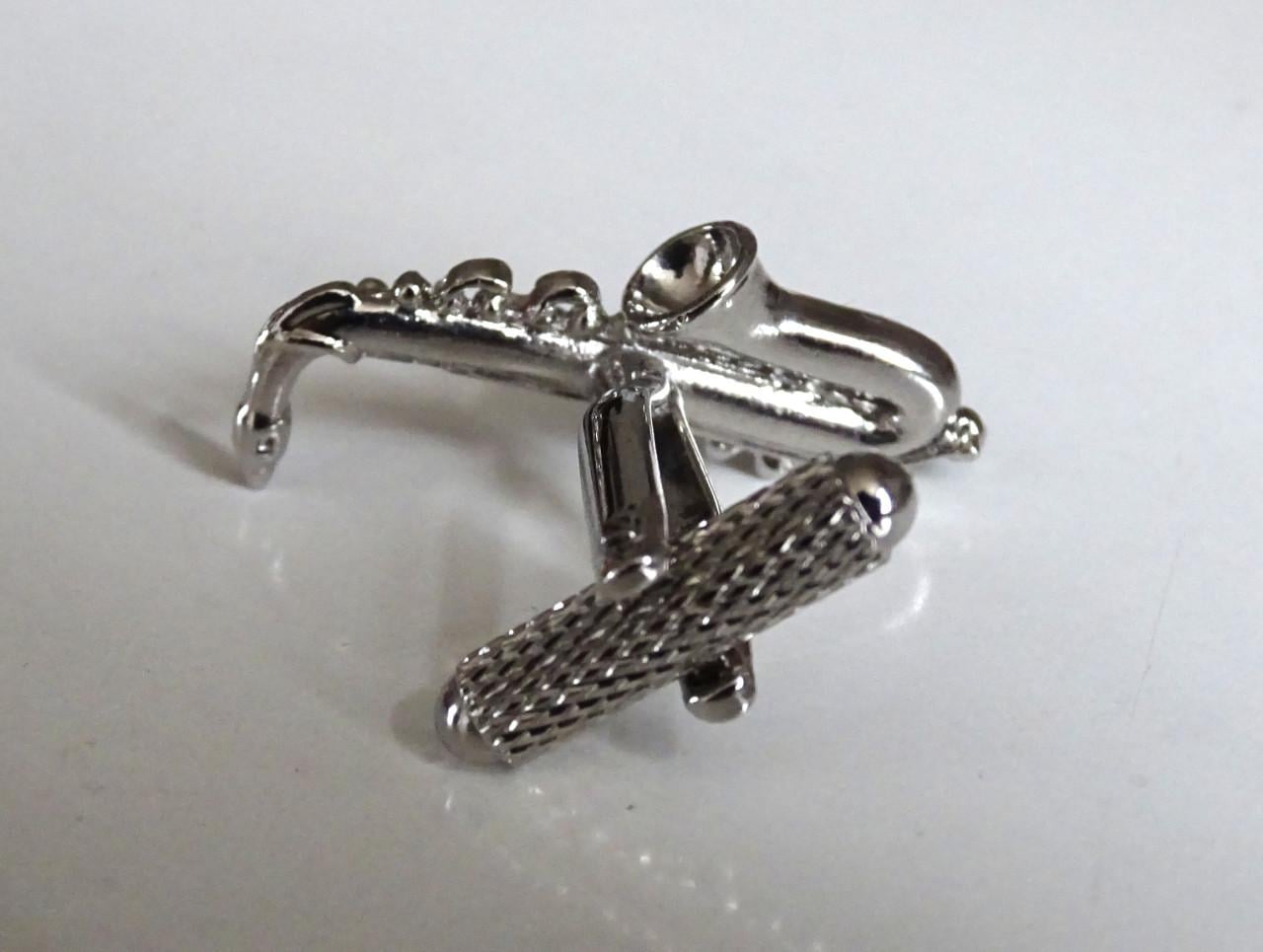 Saxofoon speldjes en manchetknoop