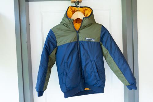 Stoere jongens winterjas van WE maat 134/140