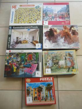 7 verschillende volledige leuke puzzels van 1000 stukjes, zo goed als nieuw