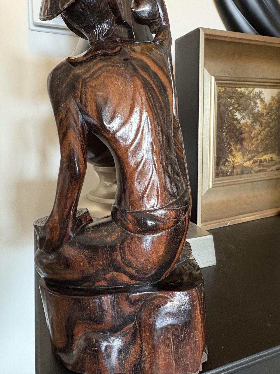 Houten beeldje uit Bali , Indonesie