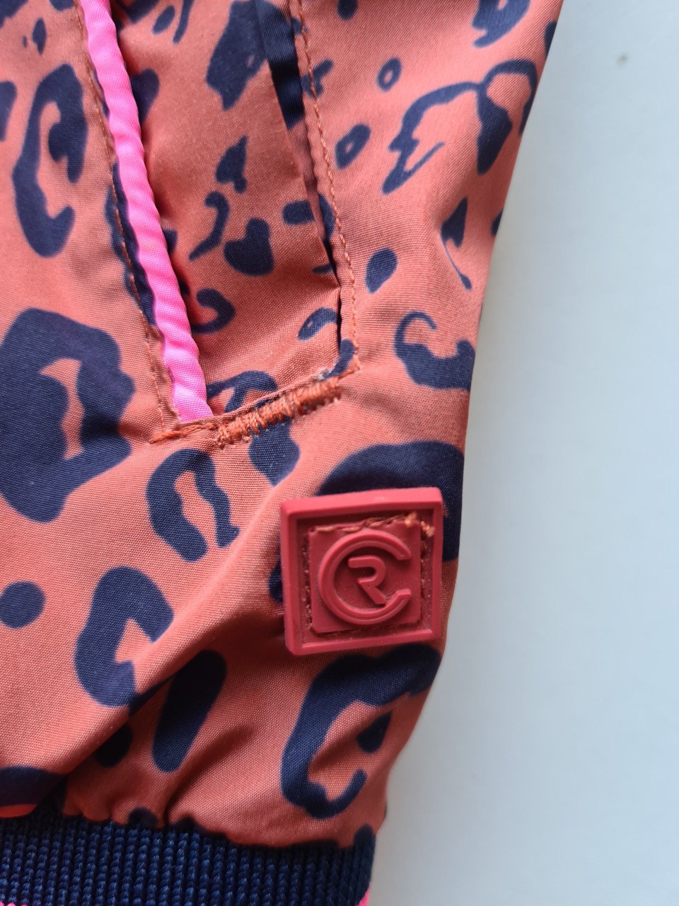 Roest bruin -zwart regenjack met capuchon van Red Code  Maat 128