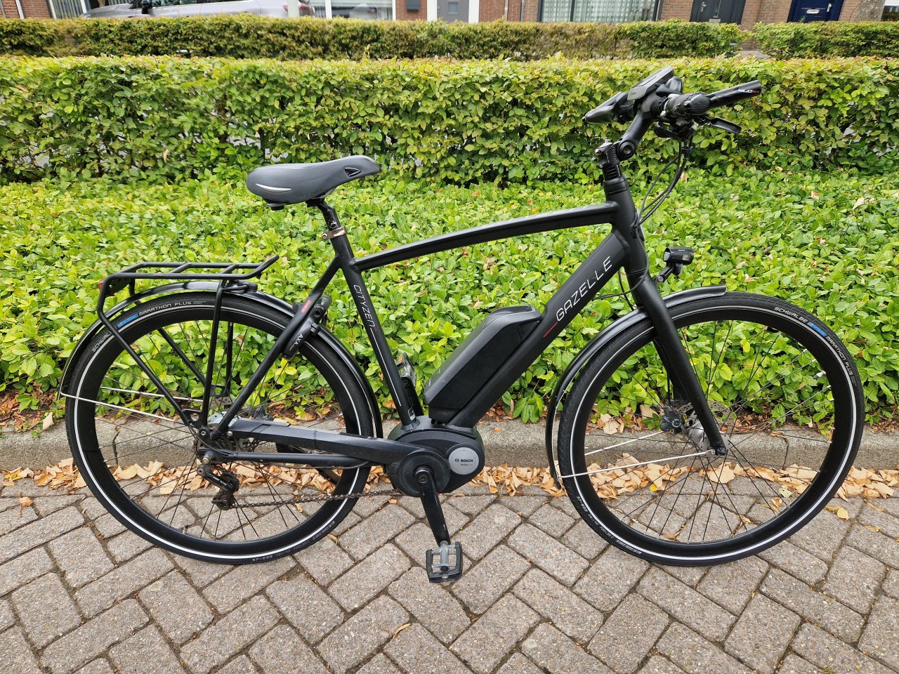 Keurig nette Gazelle elektrische heren fiets met Bosch middenmotor