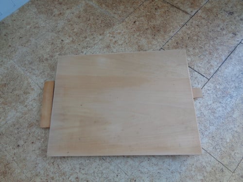 Houten tekenblad met bijbehorende tekenhaak.