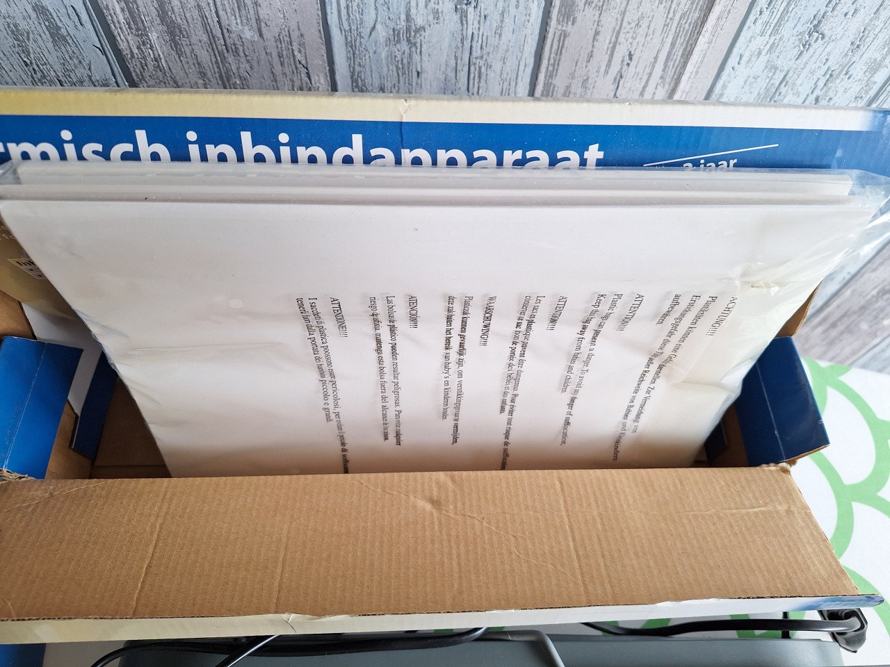 Inbindapparaat met inbindmappen
