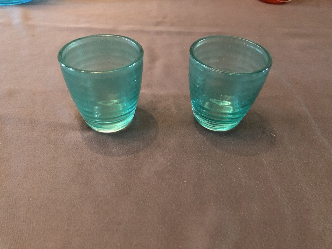 3 oranje waxinelichtjes