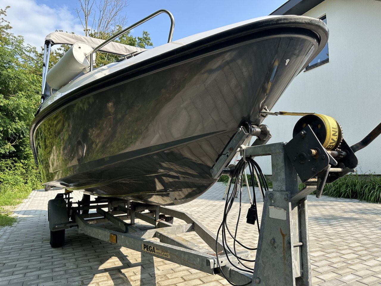 Mooie Elan 15SC met vrijwel nieuwe Mercury 60 pk en Pega trailer