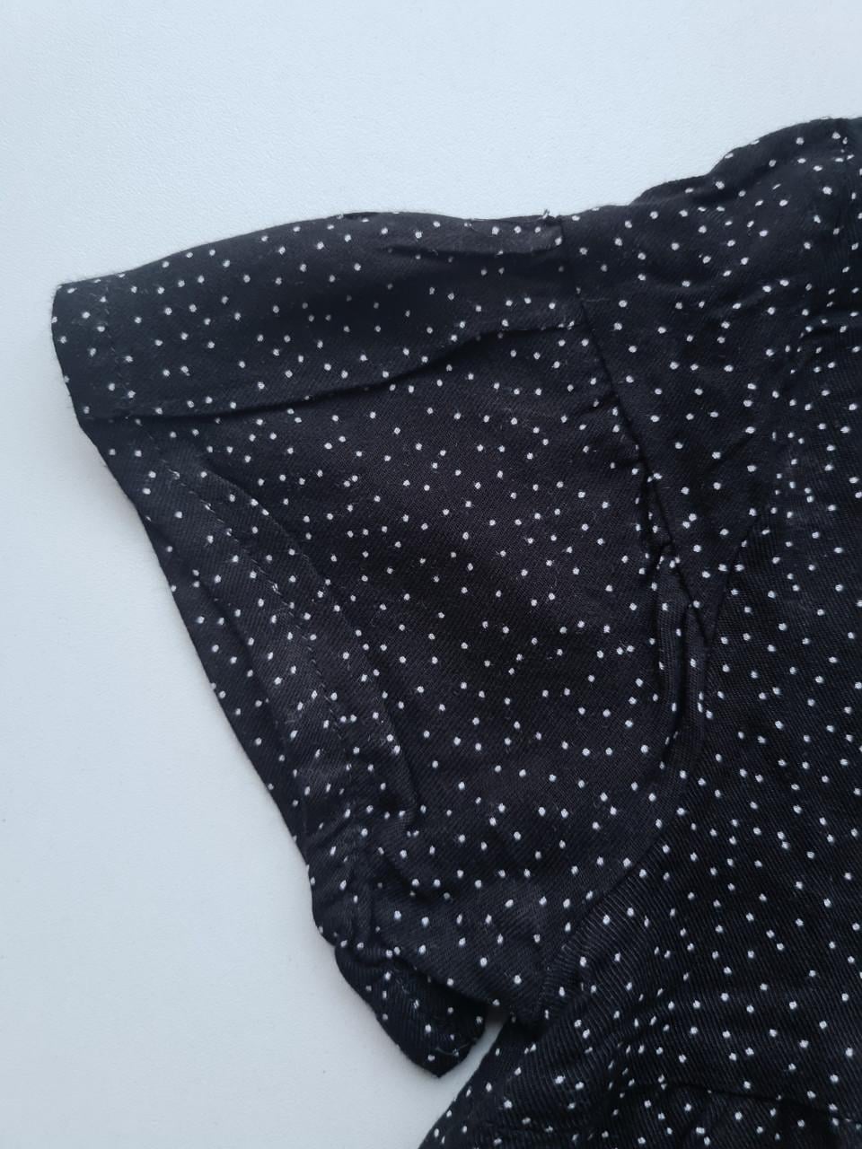 Zwart wijd vallend blousje met witte stipjes Maat 122-128