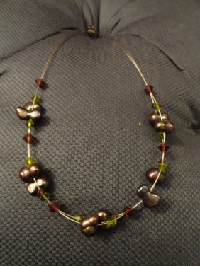 Design ketting met stenen bruin/grijs. (niet gedragen heeft € 30,00 gekost)