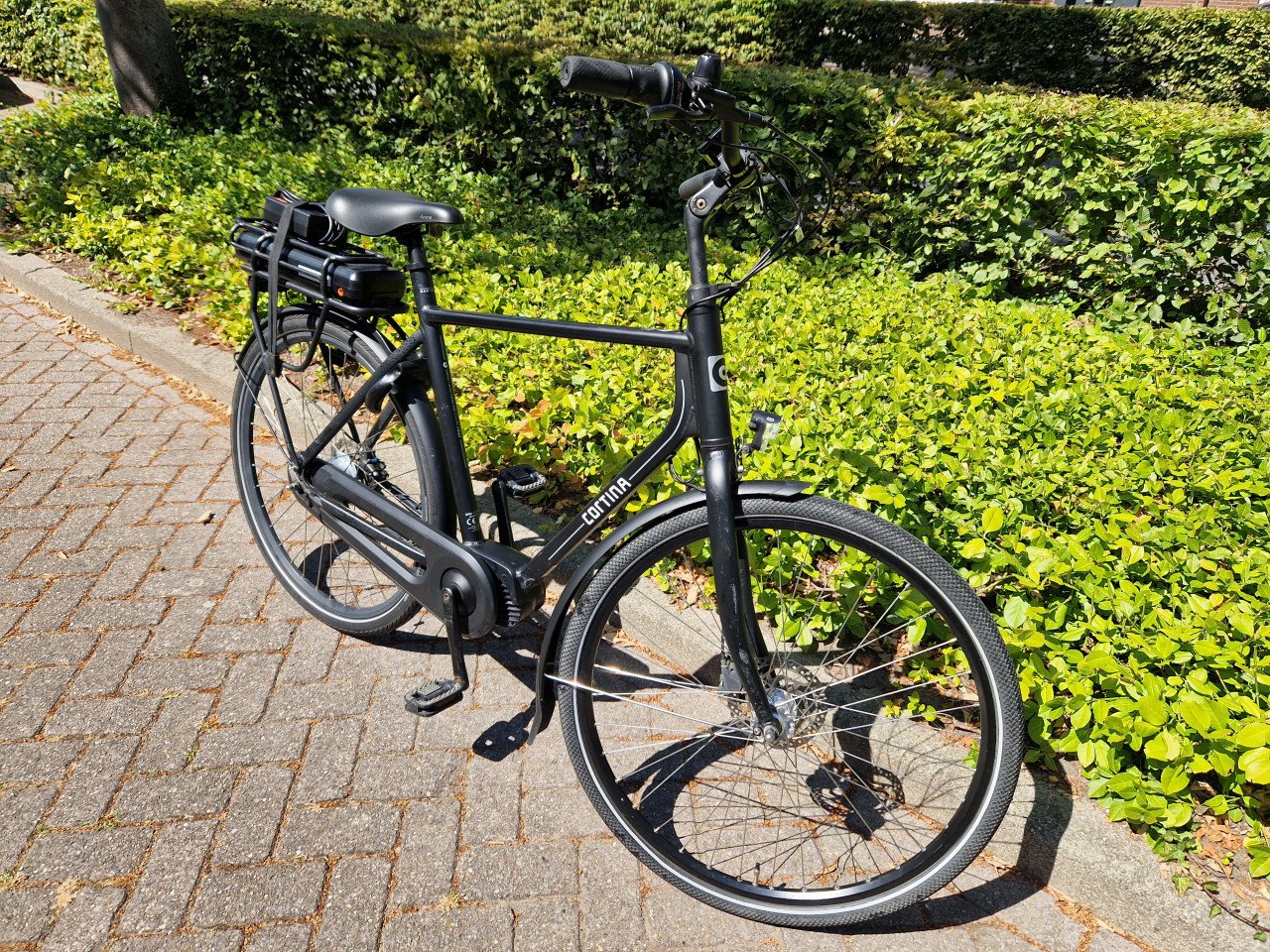 Keurig nette Cortina elektrische heren fiets met middenmotor