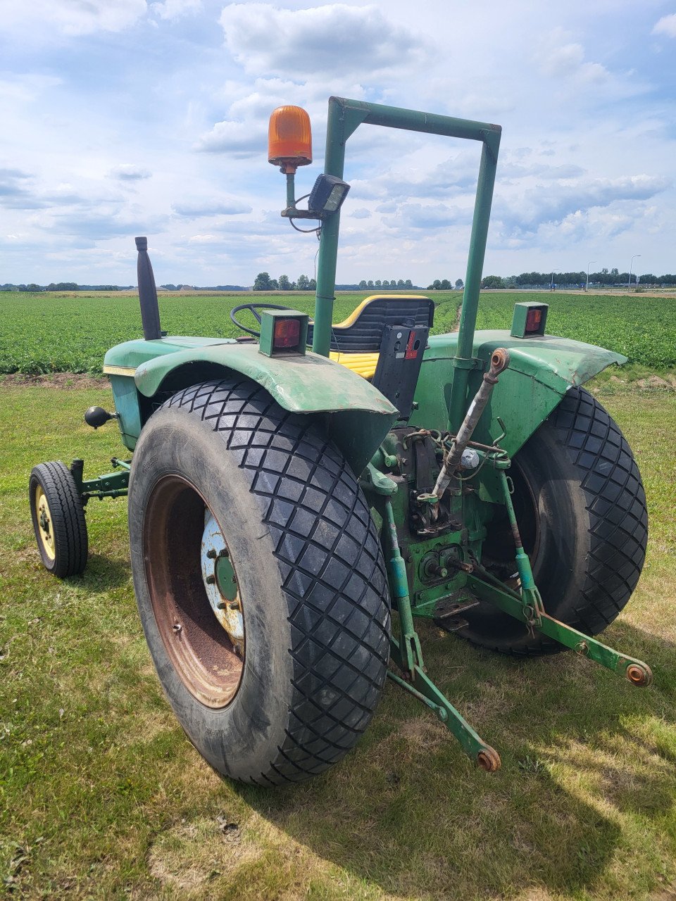 John Deere 310 met kenteken