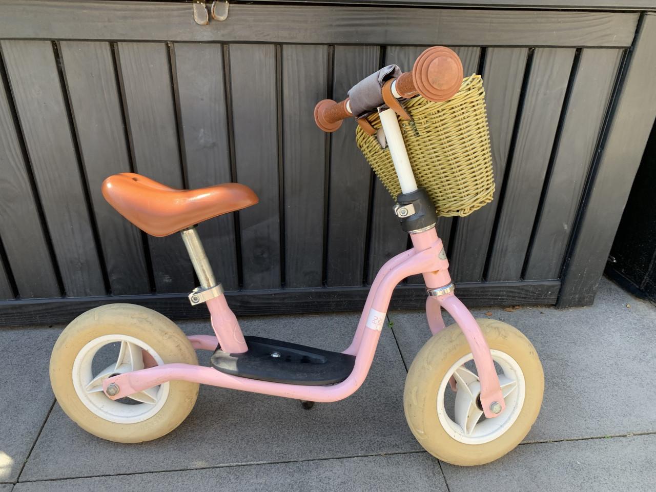 Leuke roze Puky loopfiets met mandje