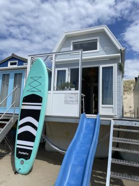 Sfeervol Slaapstrandhuisje met Sup ,Hangmat en Glijbaan te huur