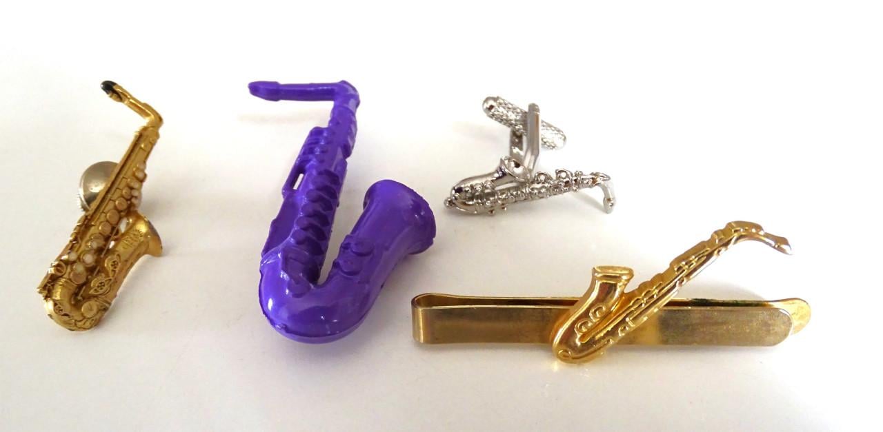 Saxofoon speldjes en manchetknoop