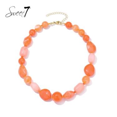 Halsketting oranje met onregelmatige kralen in warme tinten