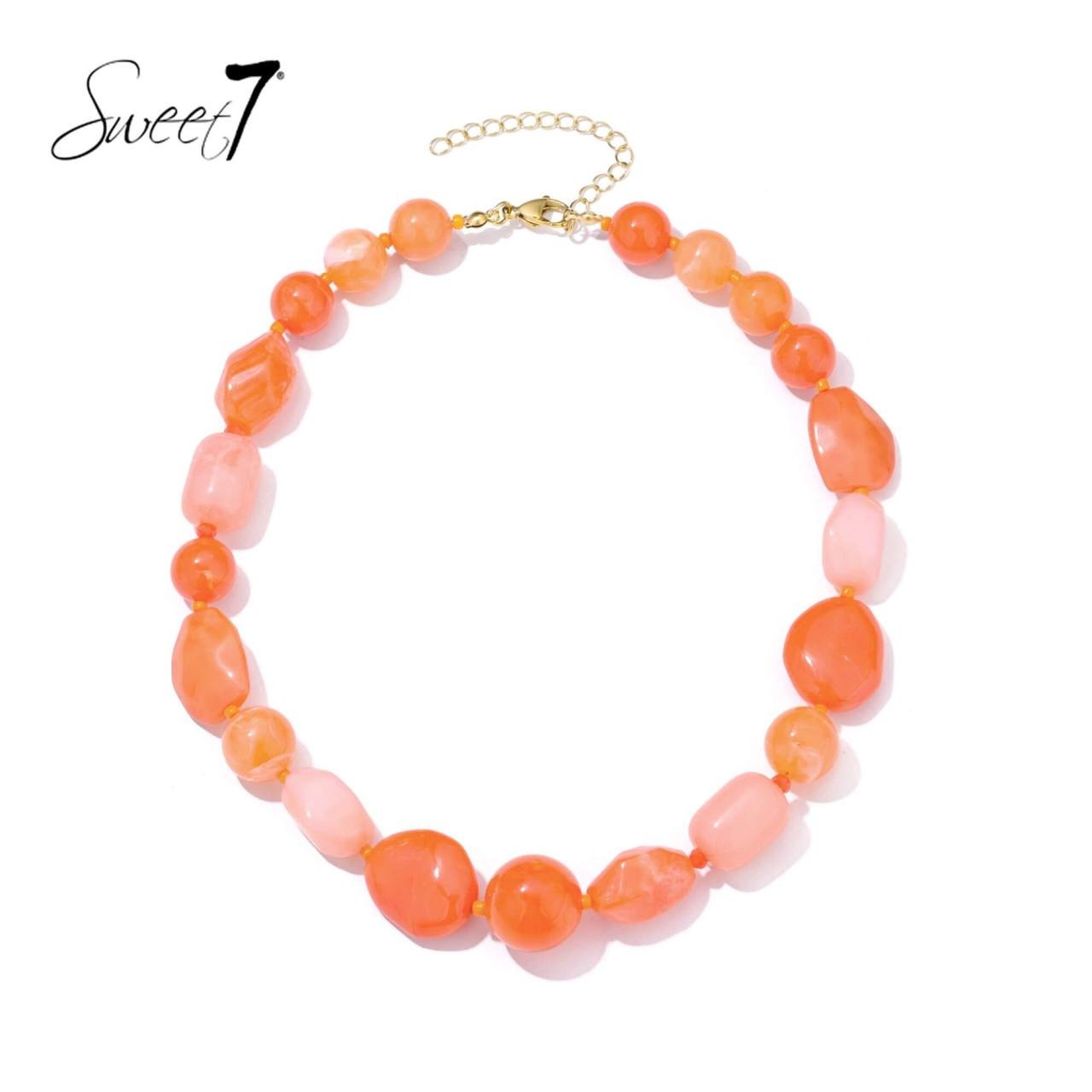 Halsketting oranje met onregelmatige kralen in warme tinten