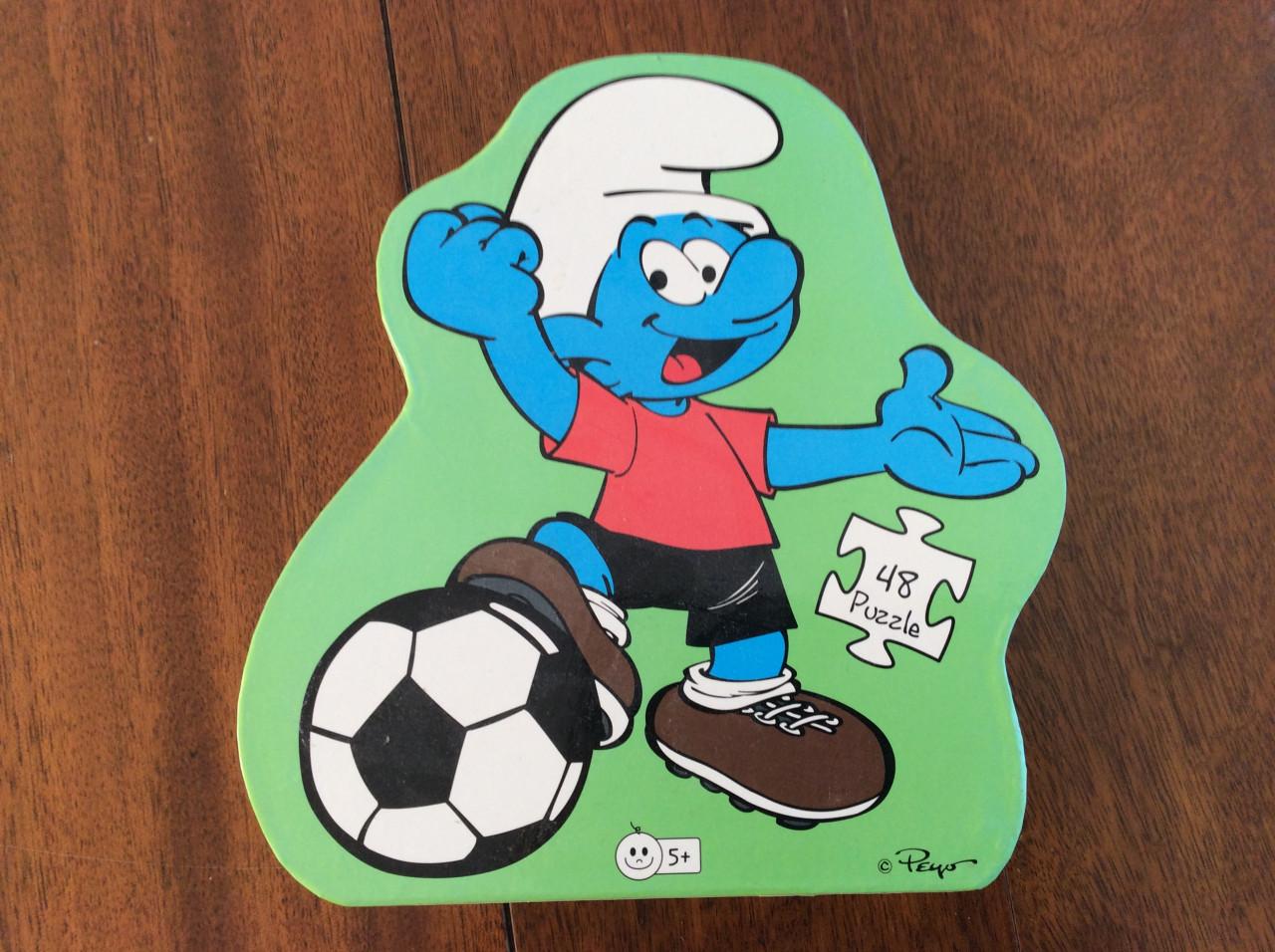 Puzzels.     Smurfen.    320 stukjes en 54 stukjes.
