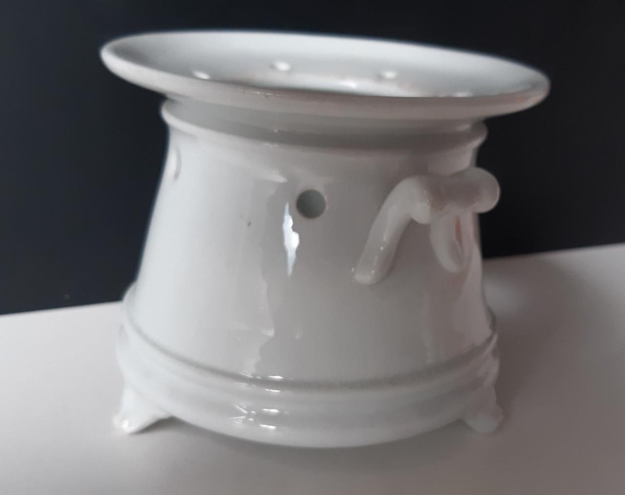 Petrus Regout wit theelicht op pootjes met vetschuitje