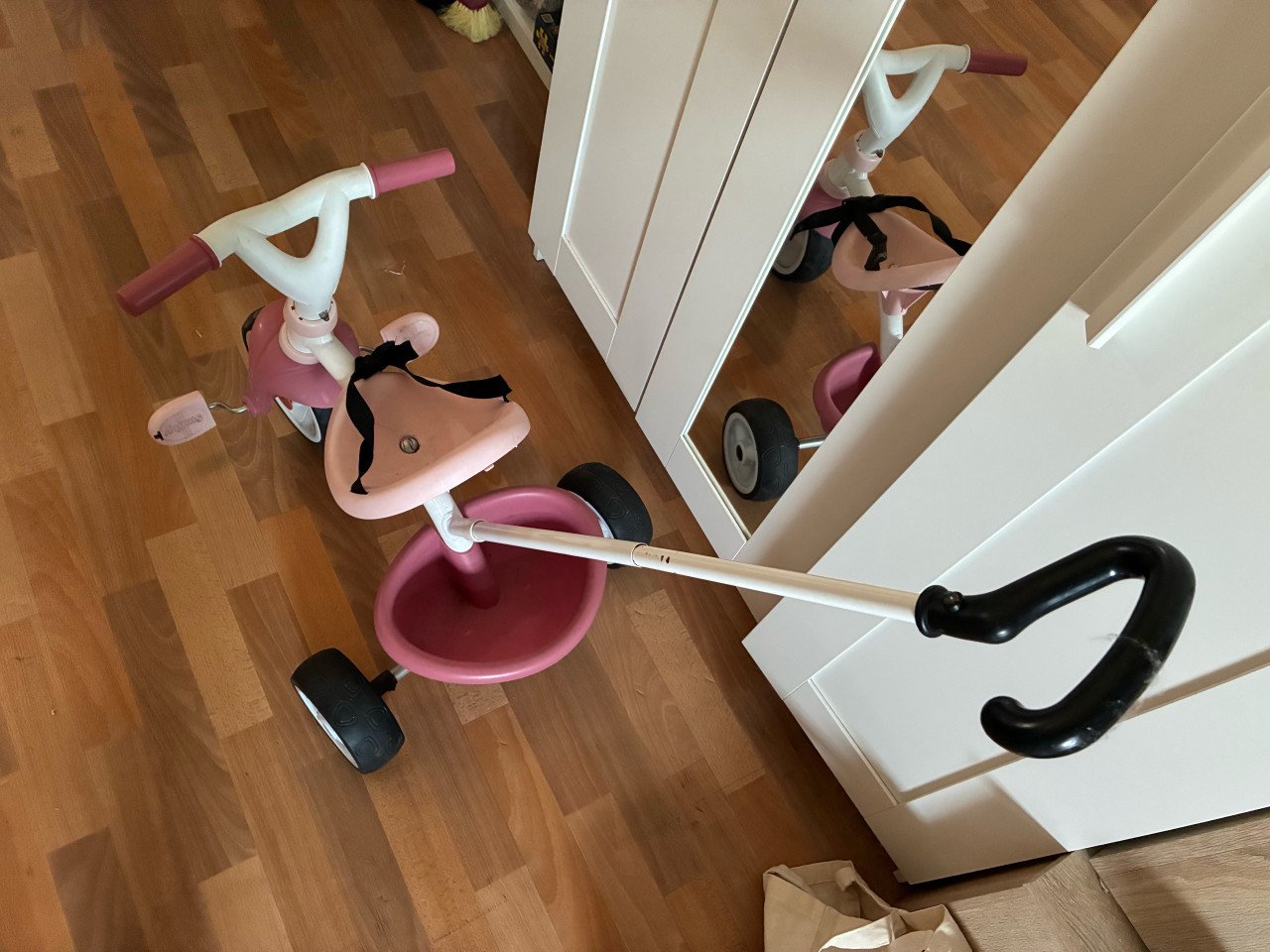 Driewieler roze met zitje en handvat