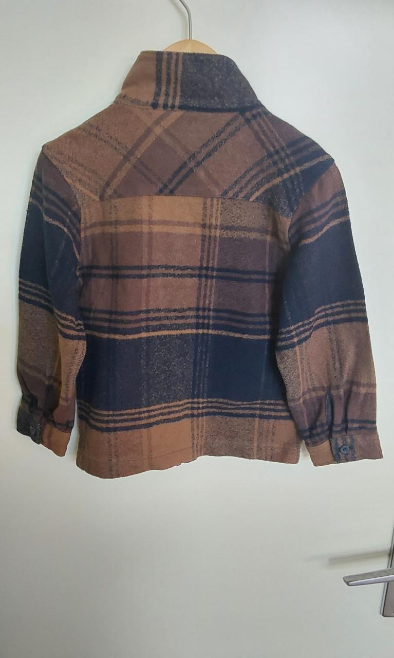 Bruin en blauw vest van de Primark in maat 116