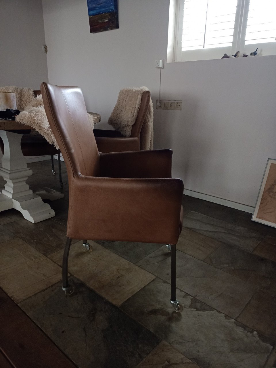 Lederen eetkamer stoelen op wieltjes
