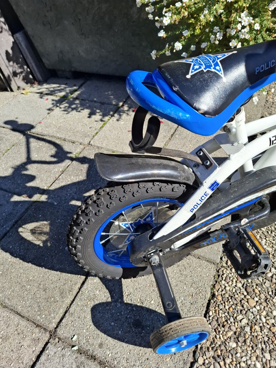 Politie fietsje met zij wieltjes