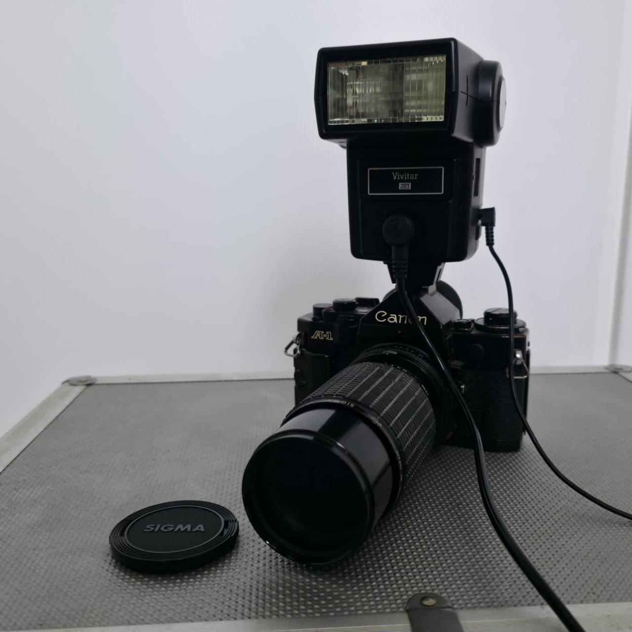 Canon A1 Spiegelreflexcamera met complete set accessoires
