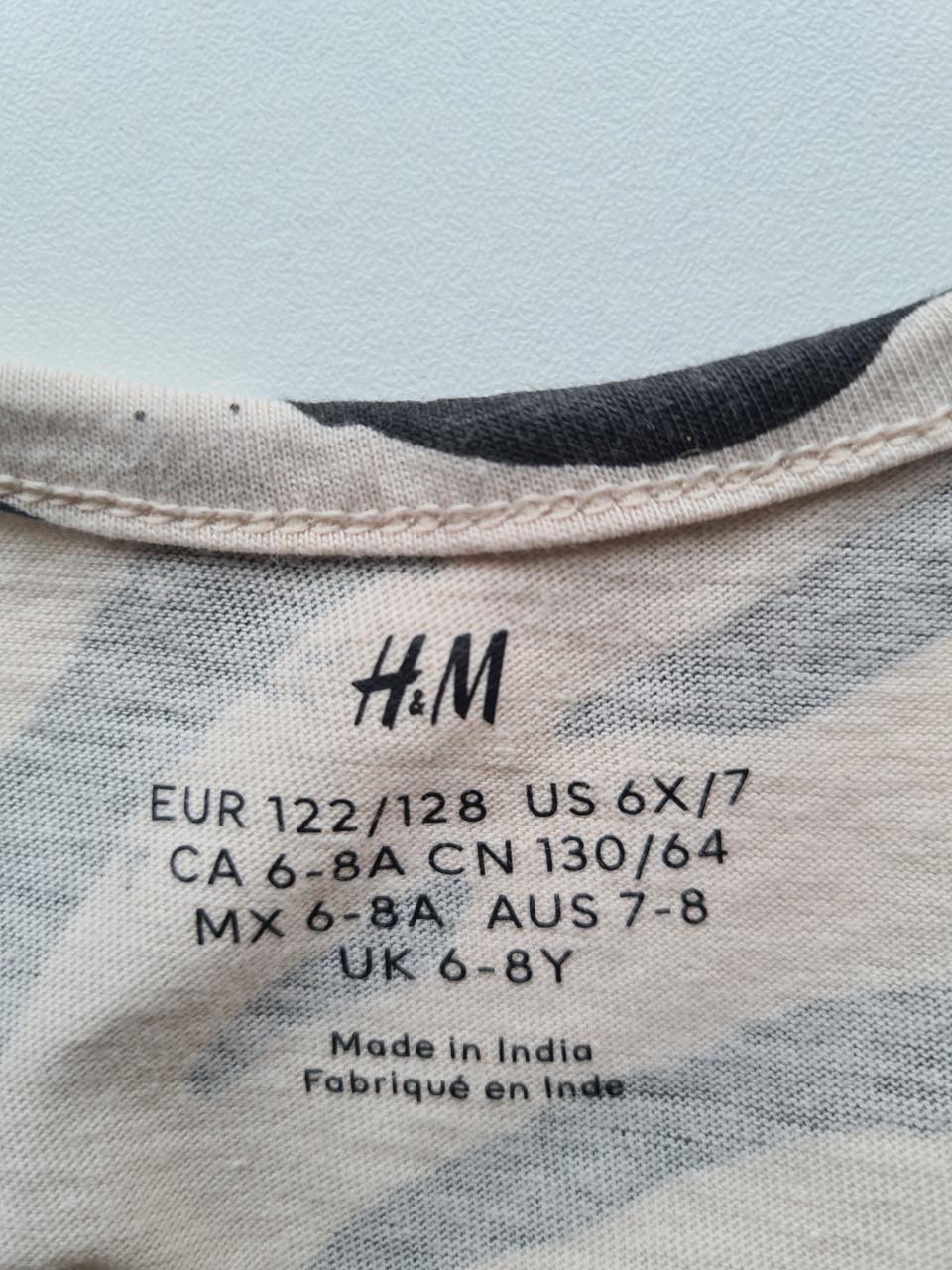 Ecru, beige met zwarte dierenprint jurkje van H&M  Maat 122-128