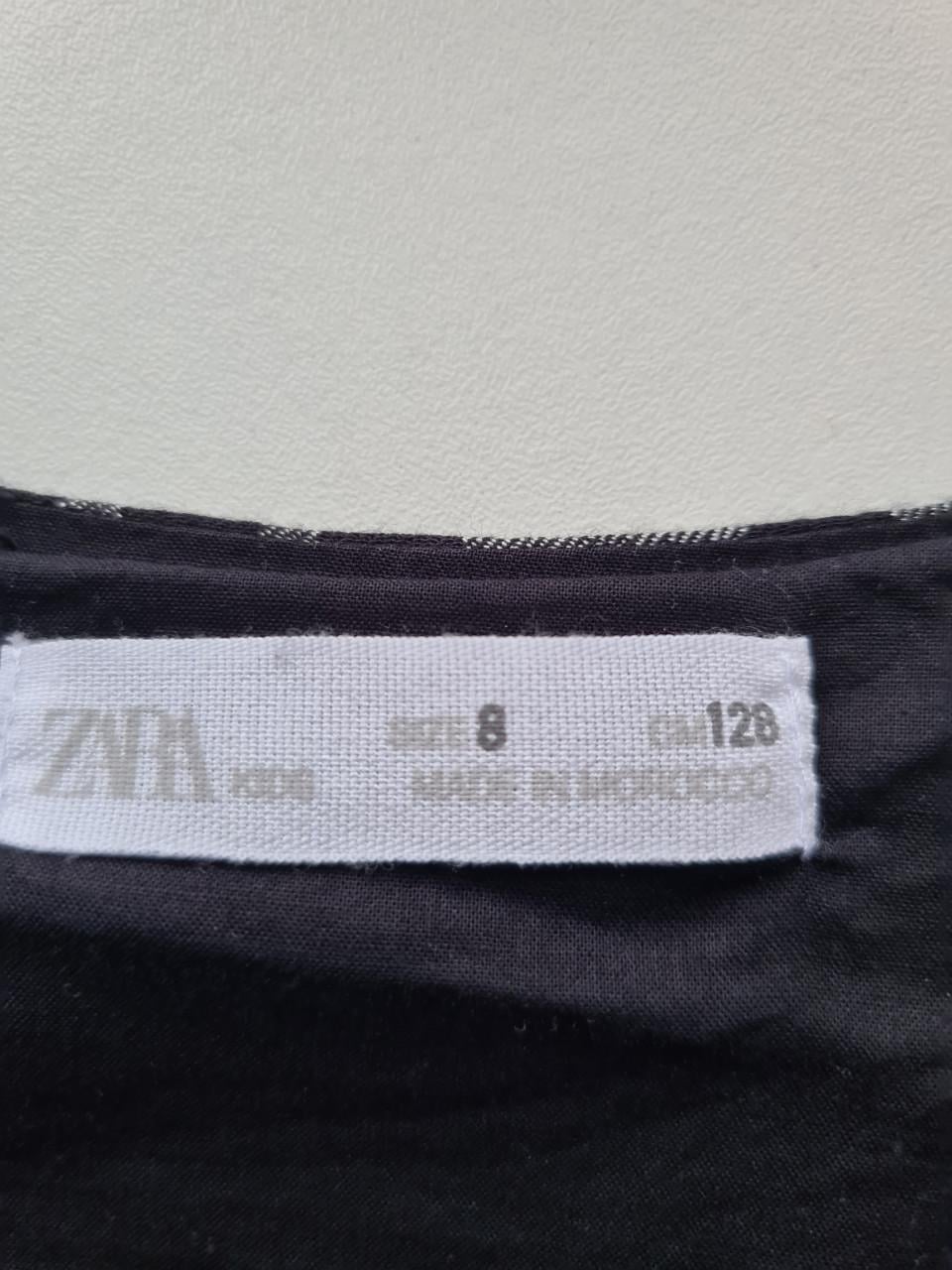 Leuk zwart-wit geblokt jurkje van Zara in maat 128.