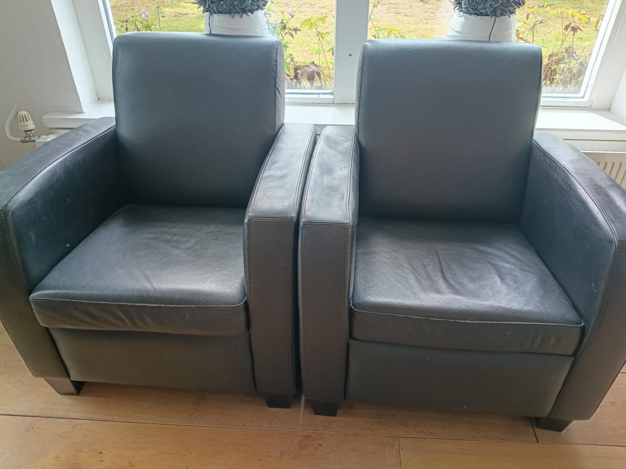 2 antraciete leren fauteuils – direct beschikbaar