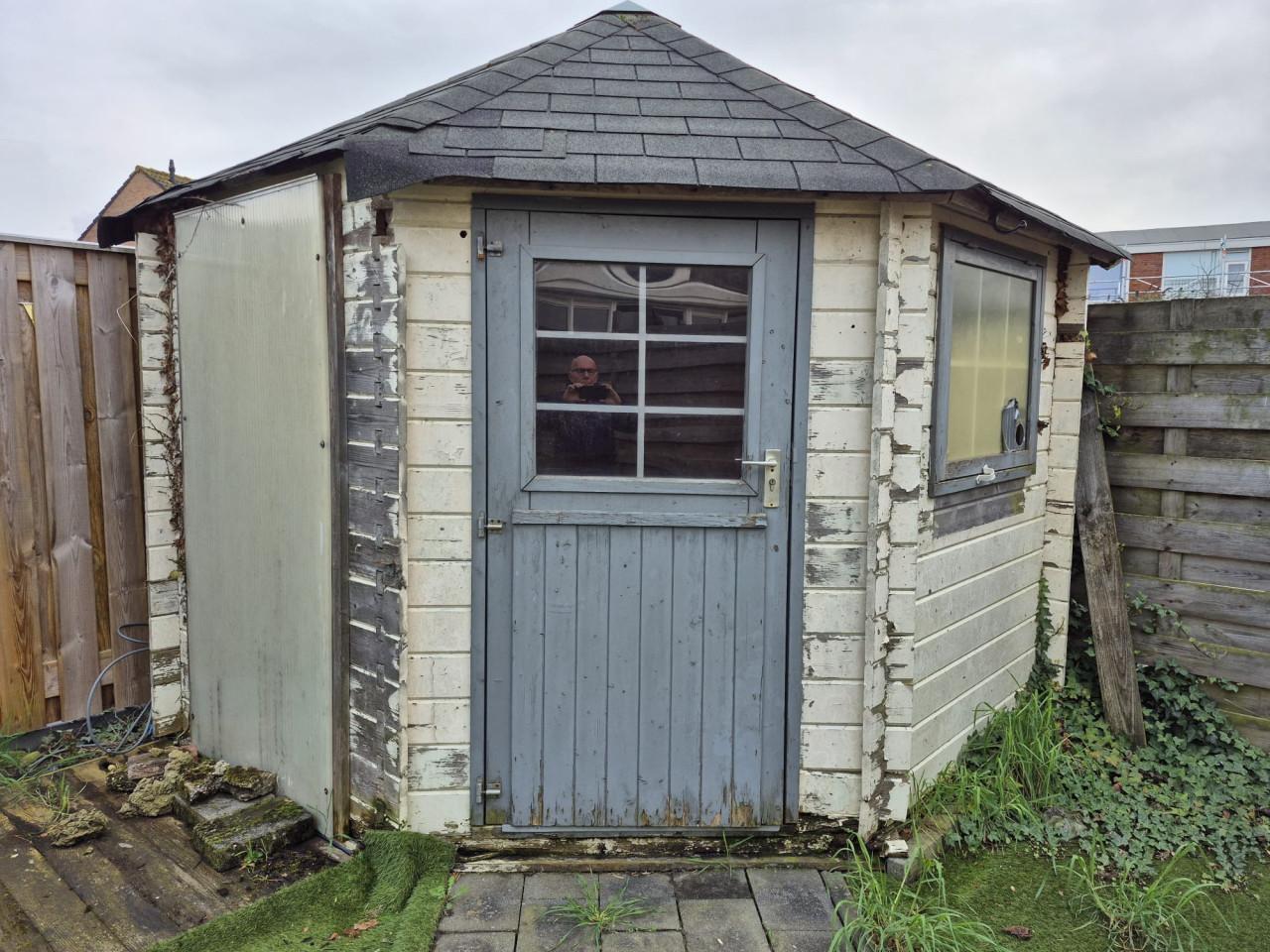 Houten tuinhuisje -opknapper