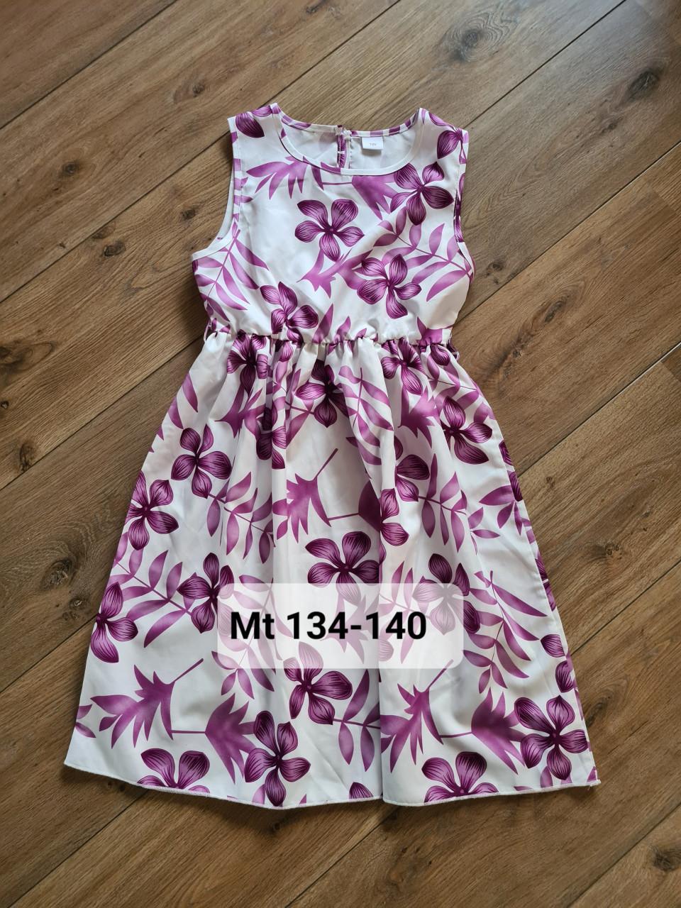 Prachtig mouwloos zomerjurkje in het wit met paarse bloemen Mt 134-140