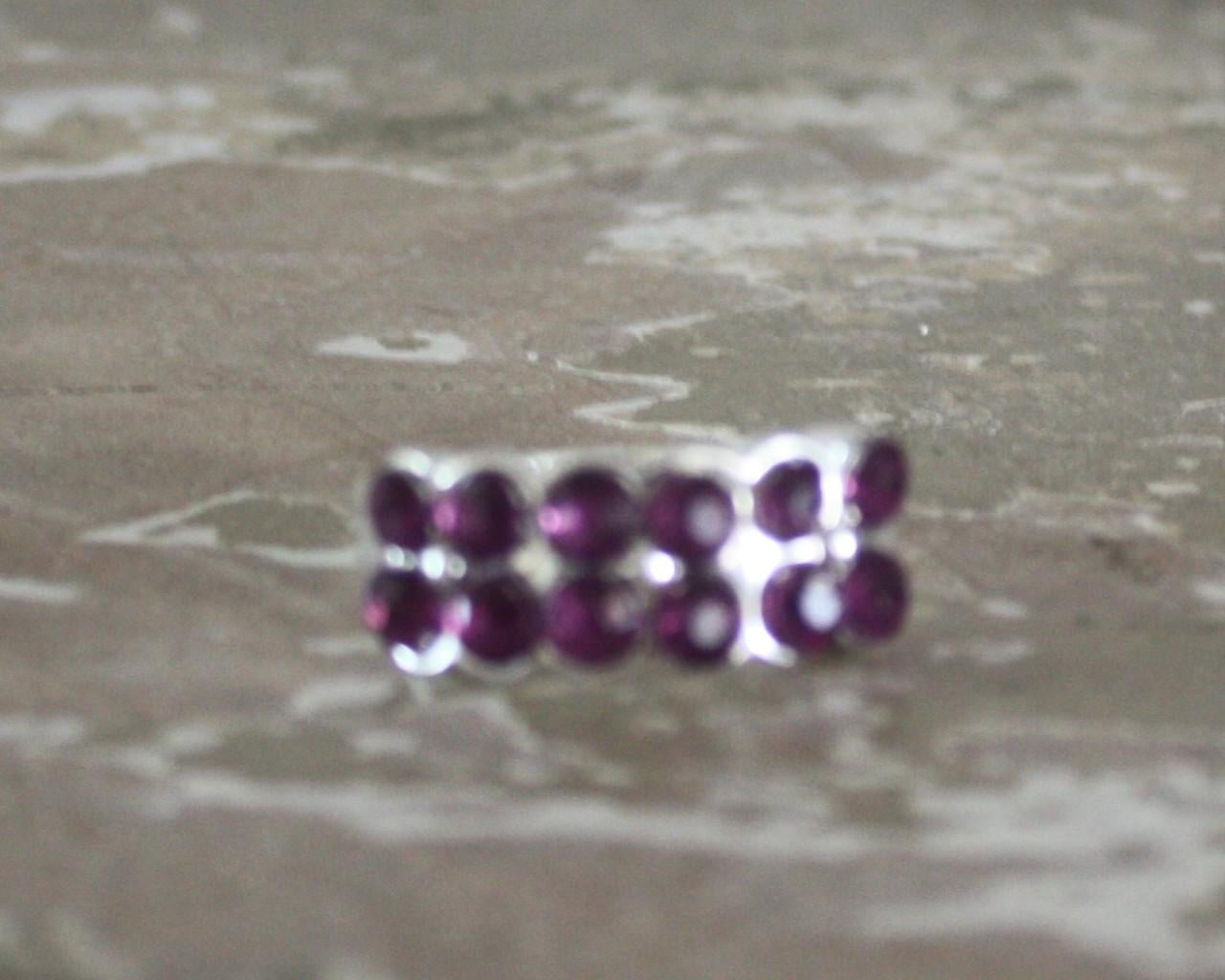 Zilverkleurige ring met parse  steentjes