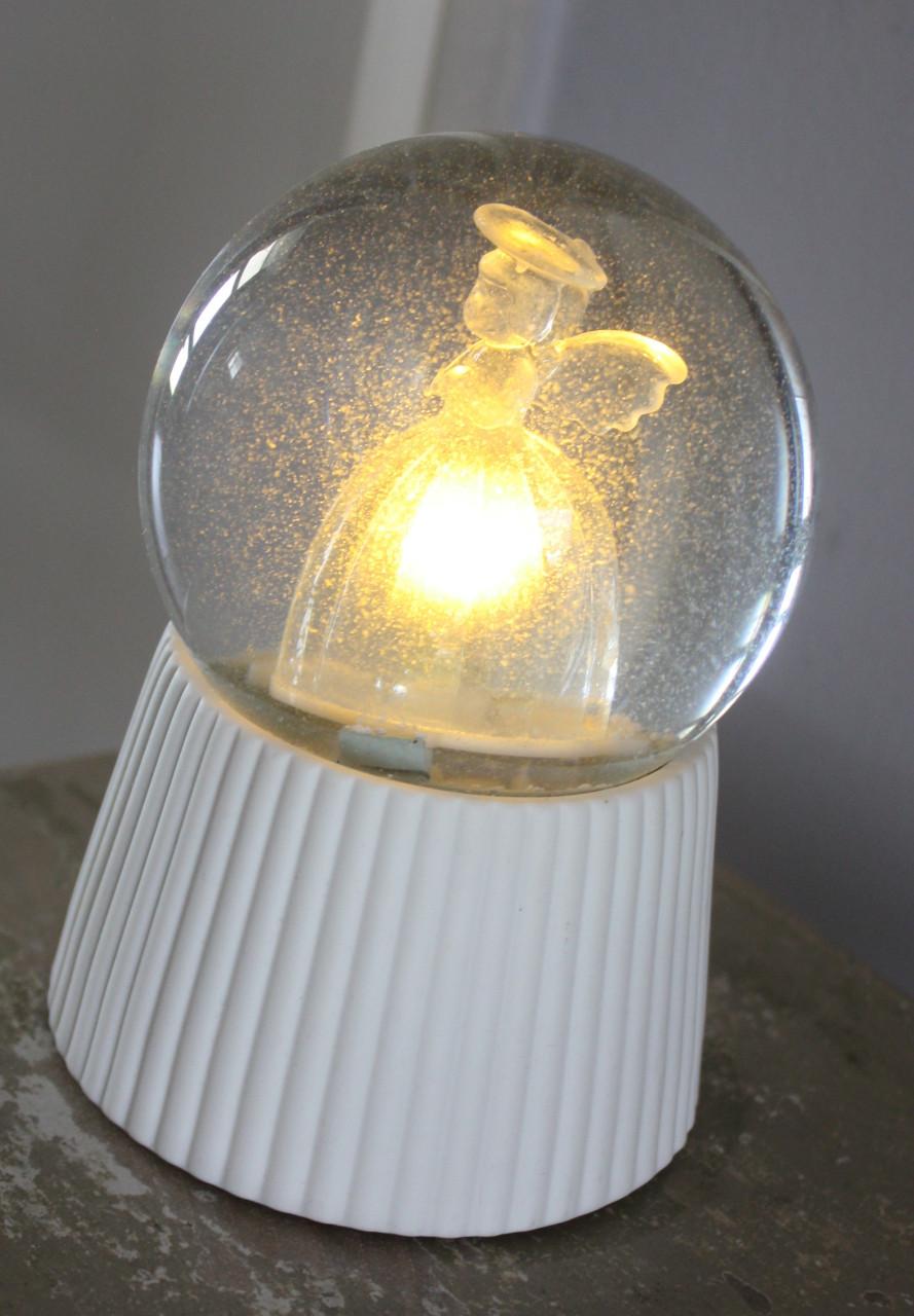 Sneeuwbol met lichtgevende engel