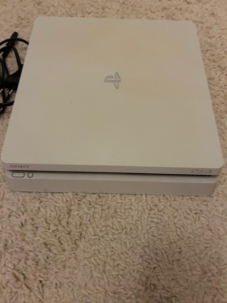 PS4 Slim 500GB - Zo goed als nieuw + 8 games
