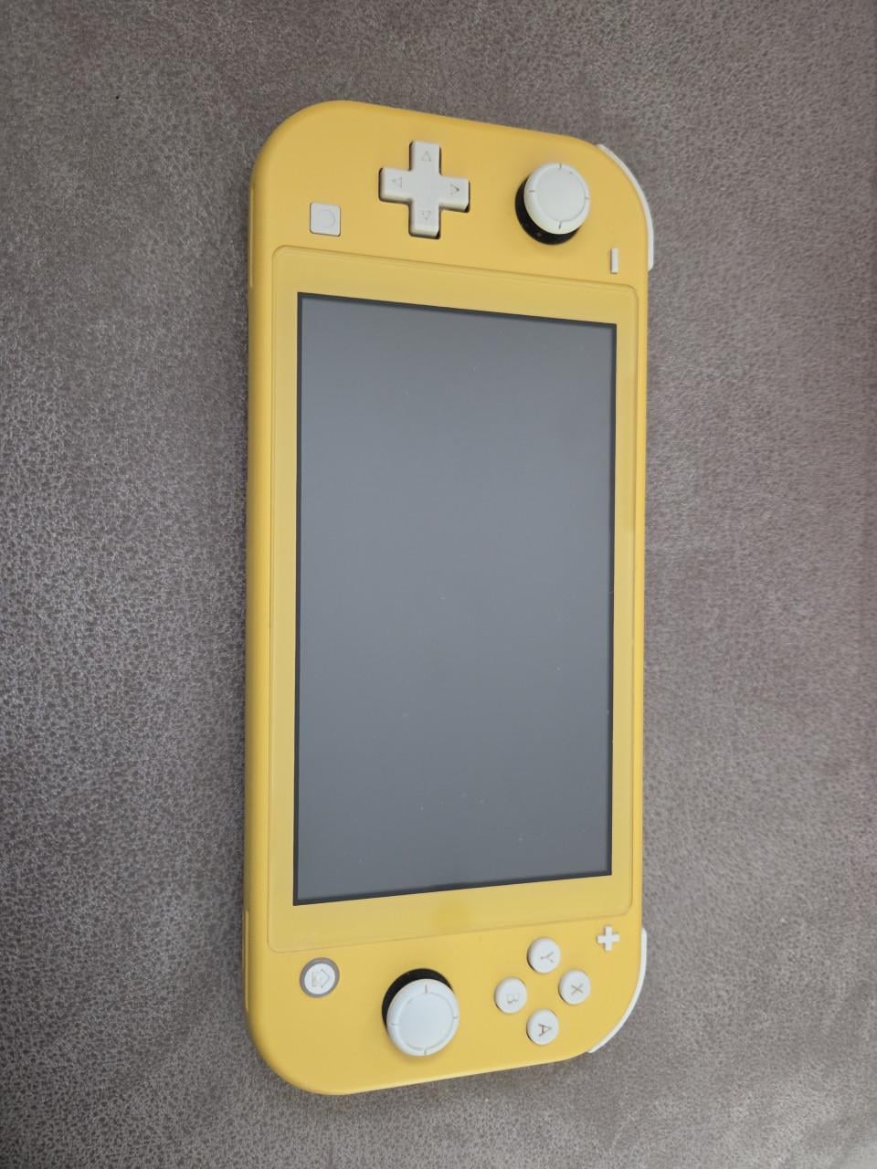 Nintendo Switch Lite grijs en geel evt. incl. spellen