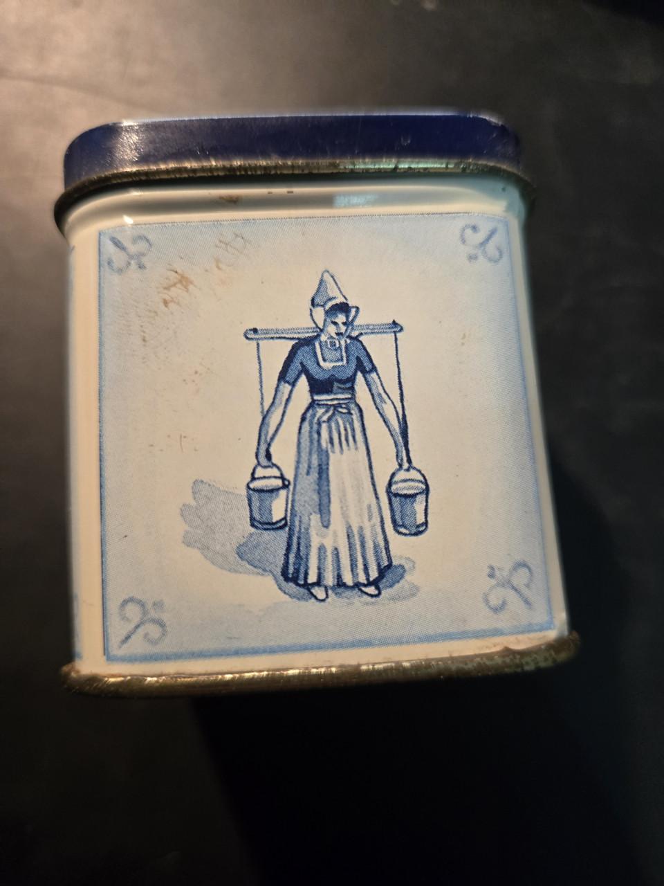 Delfst blauw blikje van roomboter babbelaars, leeg