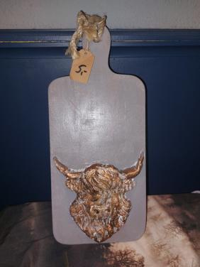 Plankje met schotse hooglander