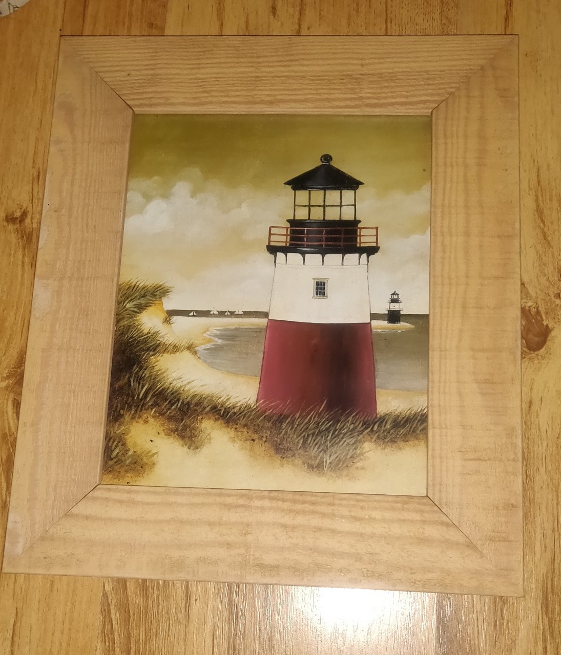 Vuurtoren foto in een houten lijst