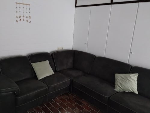 Grote suede hoek bank