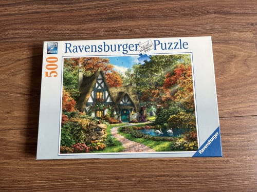 Ravensburger puzzel huis aan vijver