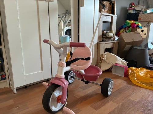Driewieler roze met zitje en handvat