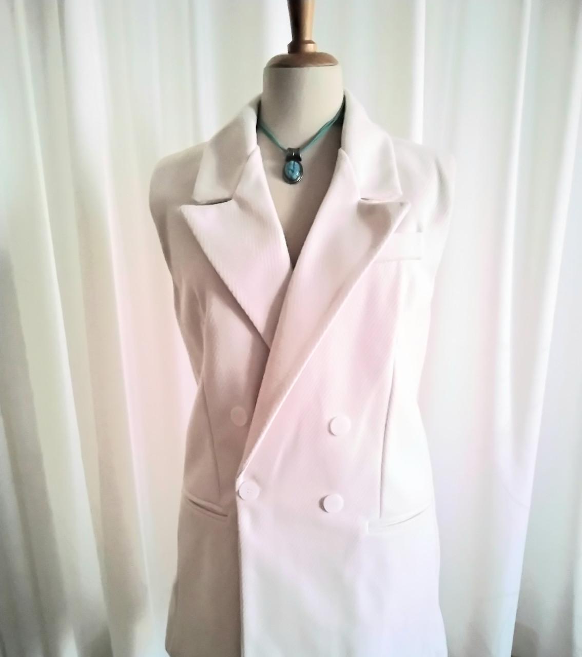 Prachtige lange crème bodywarmer Maat 42