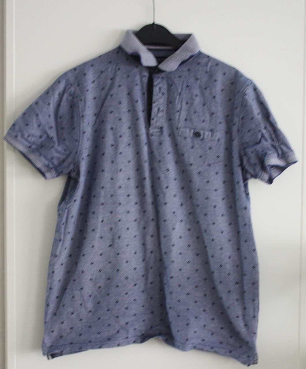 Blauwe polo shirt met patroon maat L