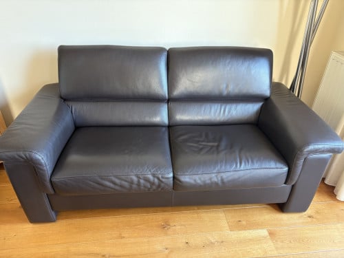 Te koop: donkerbruine lederen bank
