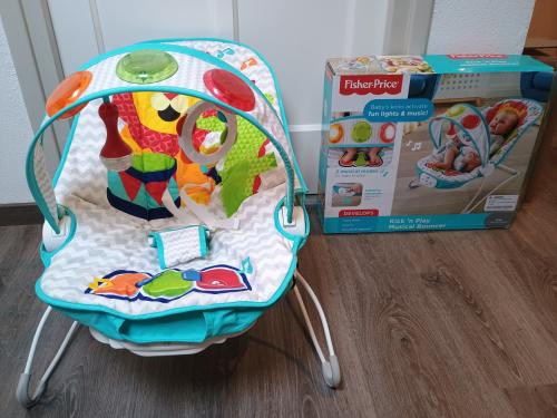 Kick and play musical bouncer