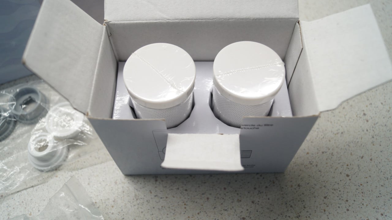 Puramane waterfilter voor op de kraan met 2 extra filters.
