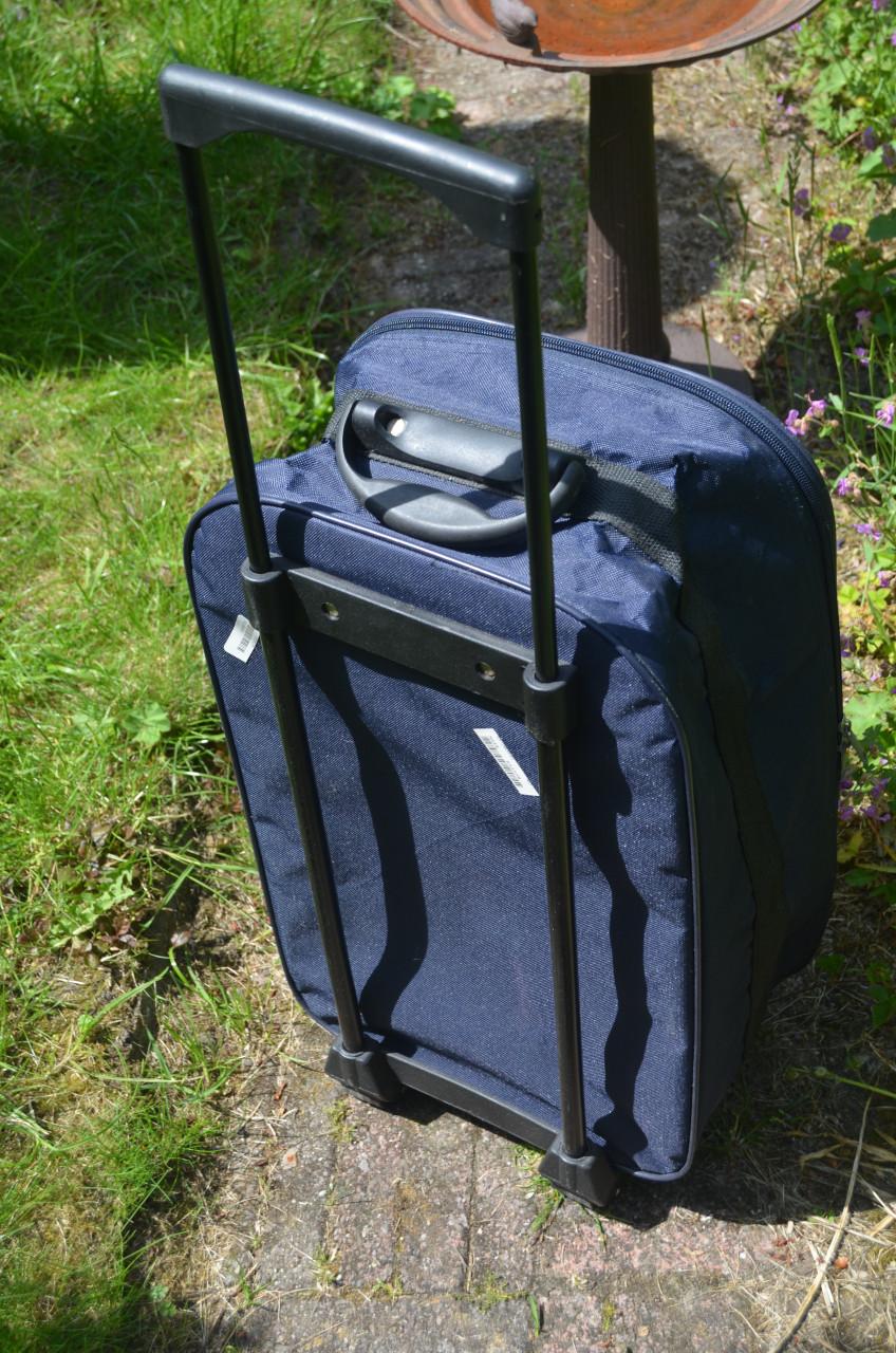 Donkerblauwe rolkoffer